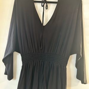 White Birch V neck shirt with smocked at waist.